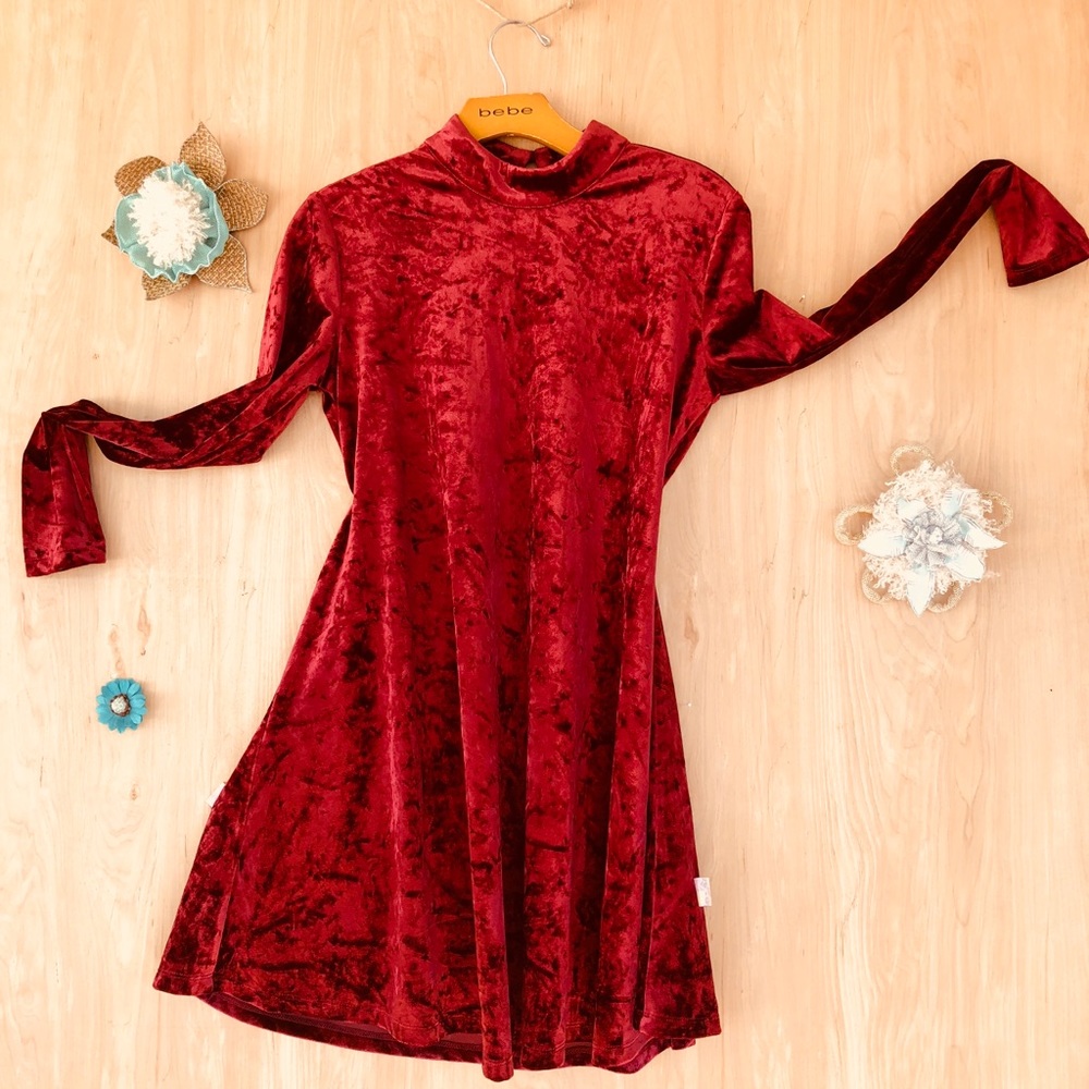 A loose fit, red velvet dress.